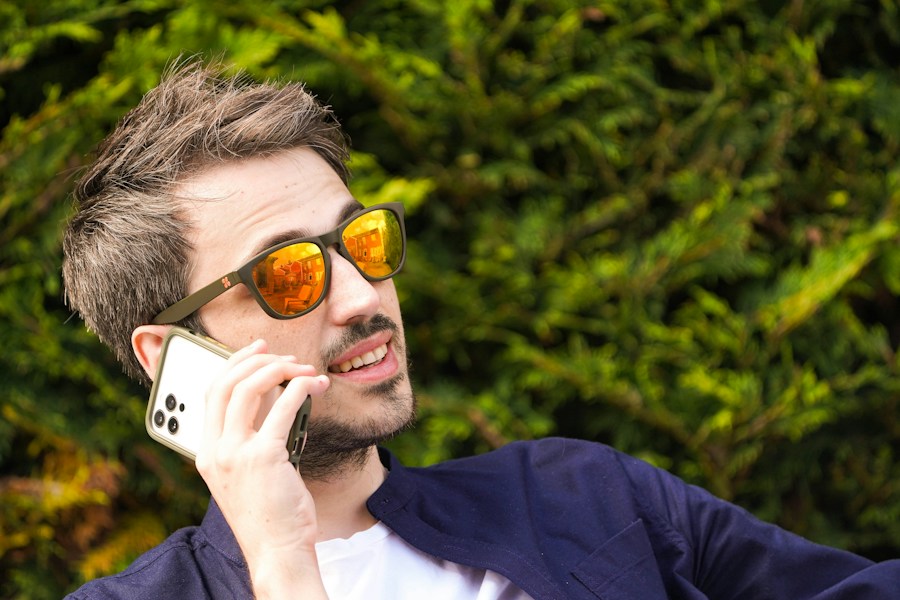 A man talking on the phone outdoors